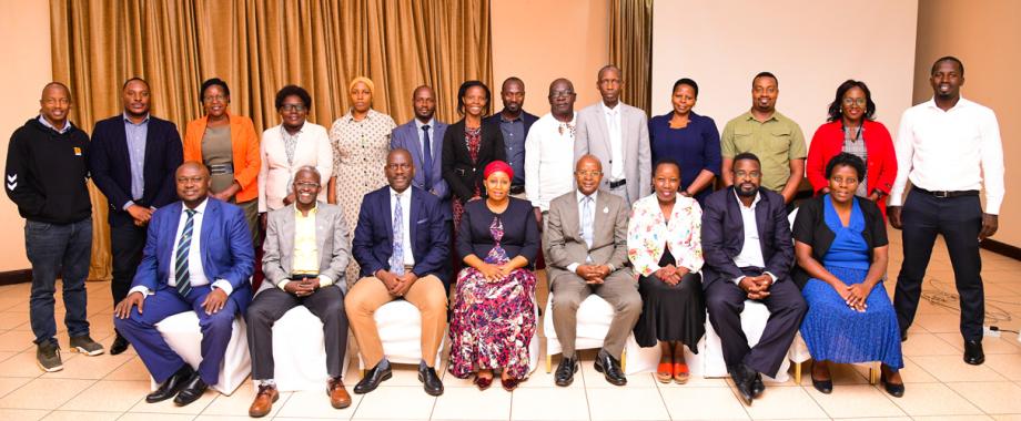 Director, Mak DRGT Prof. Edward Bbaale (Seated 4th Right) flanked by Prof. Laura Orobia (Left) from MUBS at a breakfast meeting with representatives from Colleges and the Systems Development Team on Tuesday 5th December 2023 in Kampala.