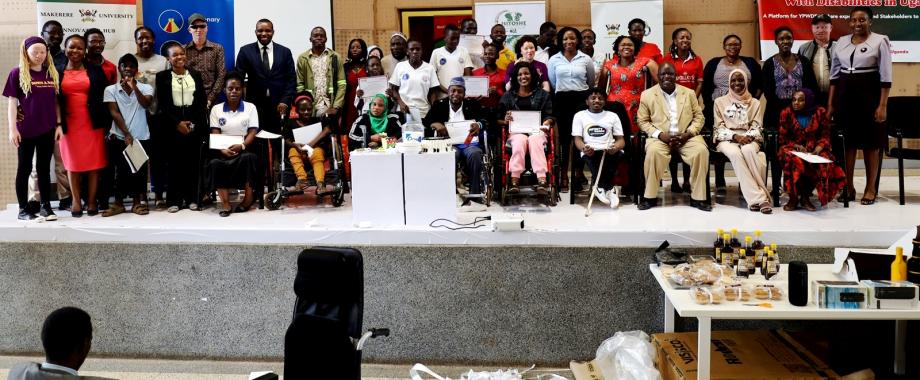 Director, Makerere University Innovations Hub and Project PI-Dr. Cathy Mbidde (Right) with officials and some of the persons living with disabilities during the celebrations on 1st December 2023.